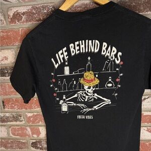 Fresh Vibes Life Behind Bars “Skeleton Drinking at Bar, Xmas Lights” Tshirt